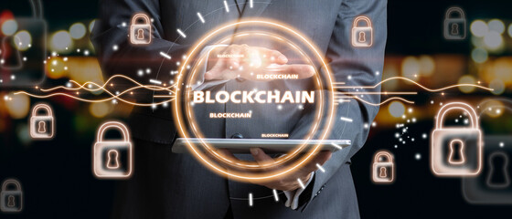 Businessman holding text blockchain in hand with lock icons locked by security
