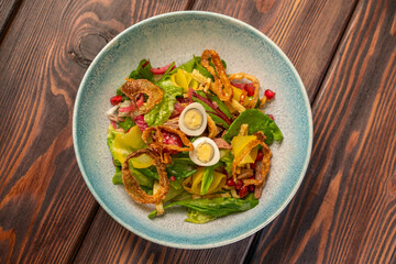 Uzbek salad tashkent with boiled eggs, green salad