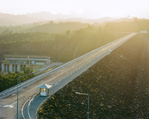 Long highway road with sunset time.This is photo shot by Film and Grain filter effect.