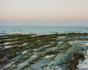 Rocks on sea in summer.This is photo shot by Film and Grain filter effect.