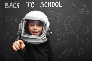 The child plans to go back to school wearing an astronaut helmet to become an astronaut