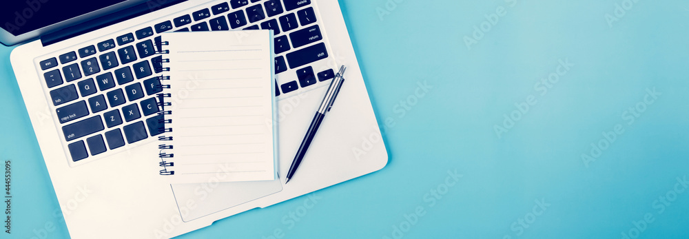 Poster flat lay of laptop computer and plant and pen on desk in office, workplace and notebook and potted t
