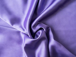 Purple satin texture background with waves and crease