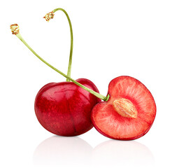 one whole and one sliced cherries on white isolated background