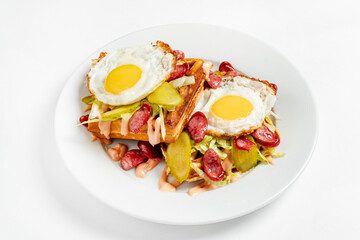 belgian waffle with fried egg and sausage