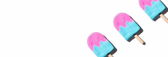 Pink and blue popsicles with shadow