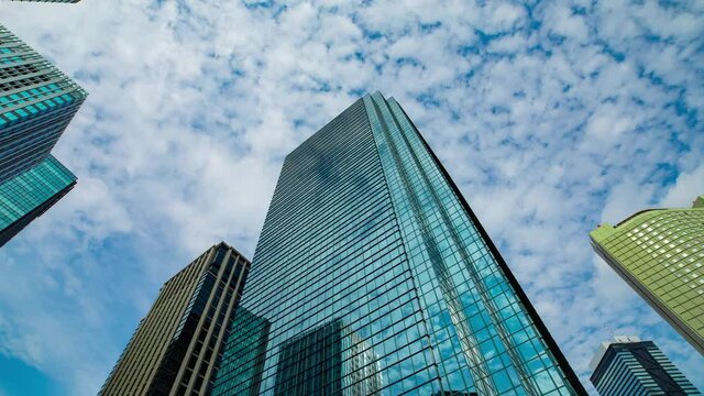 A timelapse of clowd at the building in the business town wide shot zoom