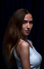 Naklejka premium Portrait of a beautiful woman with a long brunette hair. brown-haired caucasian girl. Copycpase 
