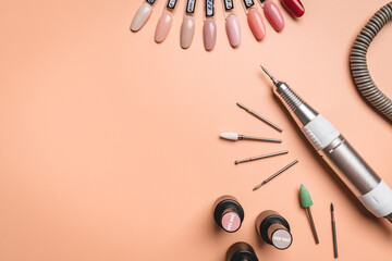 Set of manicure tools and accessories for hardware manicure on a pink background. Hardware...