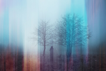 A double exposure of a spooky half transparent hooded figure. Over layered over an abstract,...