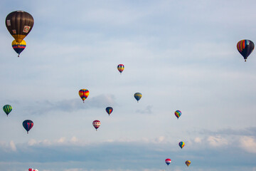 Near Wausau, Wisconsin, USA, July 10, 2021, Taste N Glow Balloon Fest. Hot air balloons fill the sky in central Wisconsin