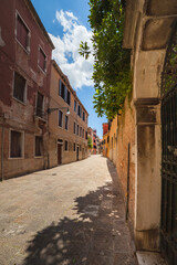 Empty street on bright summer day, Piscina Saint'Agnese street, Dorsoduro, Venice