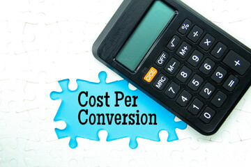 calculator, puzzle with the word cost per conversion