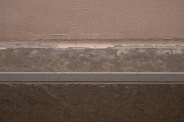 wall of light brown, gray marble, and brown materials, horizontally. background texture, wall