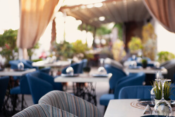 blurred background of a restaurant in the summer on the street