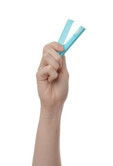 Woman holding reusable ear swab in case on white background, closeup. Conscious consumption
