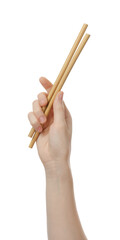 Woman holding eco friendly bamboo straws on white background, closeup. Conscious consumption
