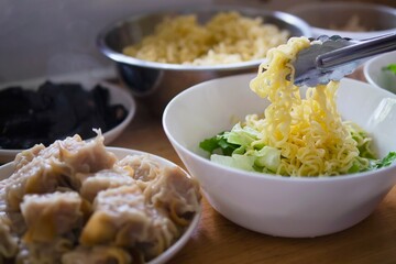 Egg noodle with big dumpling pork recipe preparation in home kitchen