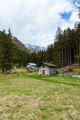 The mountain pastures, houses and meadows of val codera: a small valley near the town of Chiavenna, Italy - May 2021