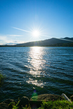 Spring sunset on the shores of Lake Pusiano, near the town of Bosisio Parini, Italy - May 2021.