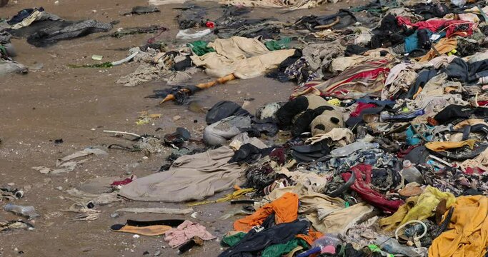 Beach Pollution garbage trash Cape Coast Ghana Africa. Ghana West Africa on the Atlantic ocean. Filthy pollution, trash, garbage and waste wash up on shore. Sandy beaches. Summer vacation destination.