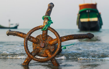A fishing boat anchored by the beach in St. Martin's Island, Bangladesh. Fishing boat rusty...