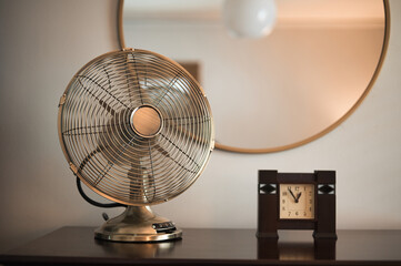 Vintage table fan and clock