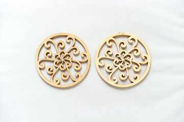 Fototapeta premium fancy laser cut wooden circles on a light background