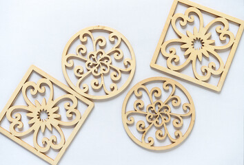 fancy laser cut wooden circles and squares on a light background
