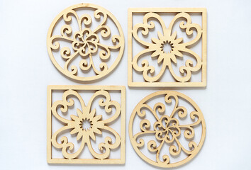 fancy laser cut wooden circles and squares on a light background
