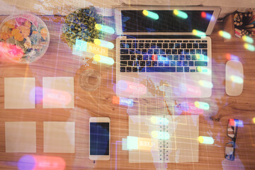 Multi exposure of data theme drawing hologram over topview work desk background with computer. Concept of technology.