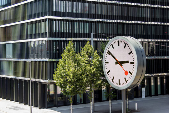 Wankdorf, Switzerland - July 10. 2021: The headquarter of the Swiss state railway company SBB, or CFF, or FFS. The huge digital clock on site symbolizes punctuality of Swiss train transportation.