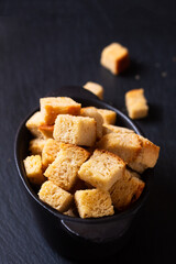 Food concept Homemade organic Croutons bread on black background with copy space