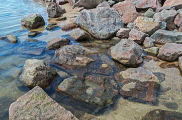 Stony shores of shallow sea