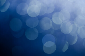 abstract blue bokeh glitter sparkle background.