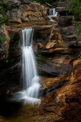 Obraz premium Gorgeous waterfalls in rocky gorge screw auger falls