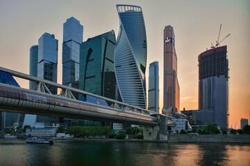 Fototapeta na wymiar Skyscrapers of the Moscow City business center at sunset. Pedestrian bridge view
