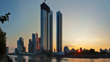 Embankment with skyscrapers of the Moscow City business center at sunset.