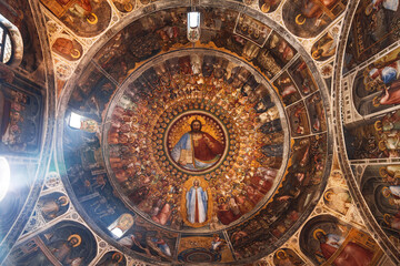 Fototapeta na wymiar The dome of the baptistery with frescoes of Christ, the saints and angels in Padua, Italy