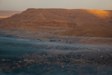 The view of the Mortuary Temple of Hatshepsut and Luxor at sunrise, the view from hot air balloon, Luxor, Egypt