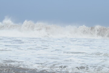 Ocean view from tropical beach with clear sky. A beautiful beach with a view of the blue sky and beautiful waves