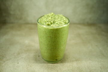 Green vegetable smoothie in the glass