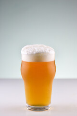 Pint of craf beer with big and creamy foam