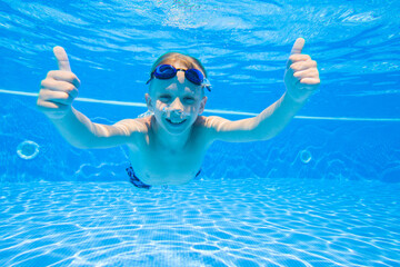 boy swimming  in pool