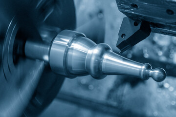 The  CNC lathe machine forming cut the metal shaft parts. The hi-technology metal working processing by CNC turning machine .