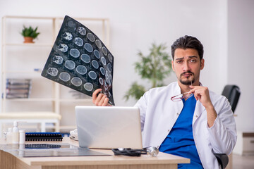Young male doctor radiologist working in the clinic