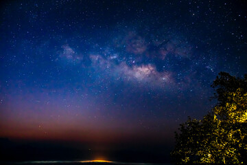 Fototapeta na wymiar Milky Way Galaxy and fog over Kong city ,Chiang mai, Thailand