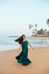 Happy woman on the beach. Сlose-up portrait of the beautiful girl. Young pretty girl. Young smiling woman outdoors portrait.