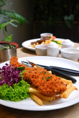 Sirloin steak, catfish and chips, and chicken black pepper. Food menu on the table