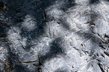 stone texture. Closeup of the rough texture of a big rock. Surface of the stone for natural background. Closeup blurred stone background texture